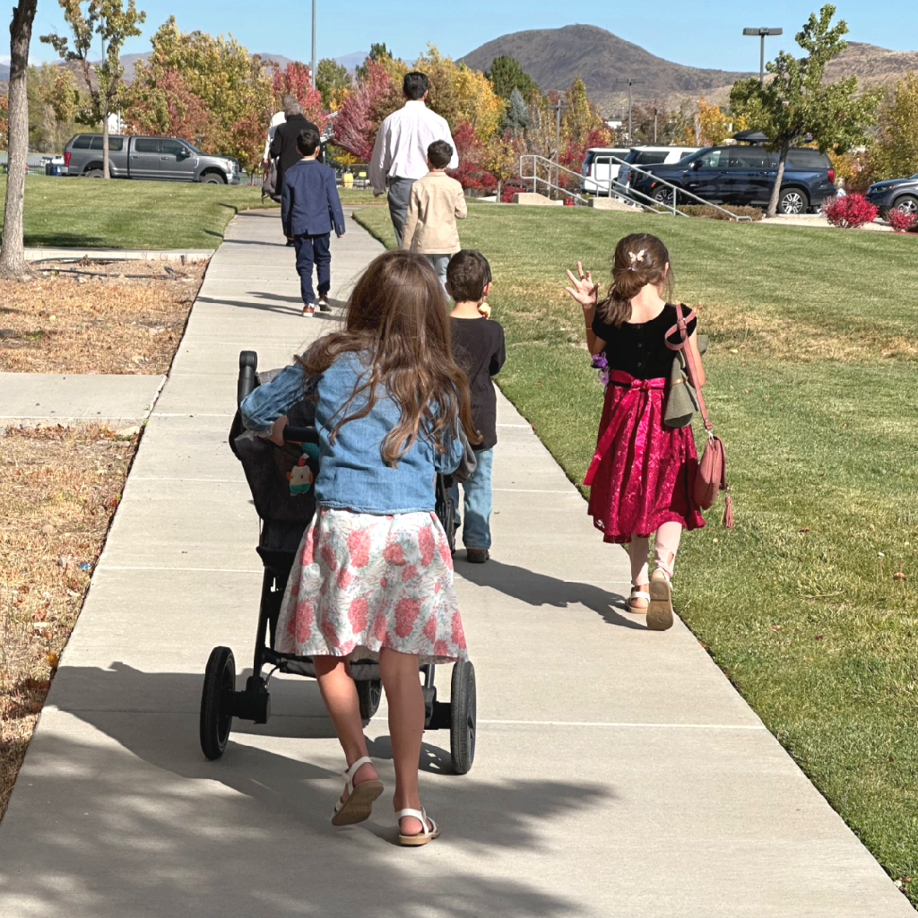 kids walking out of Mass with stroller