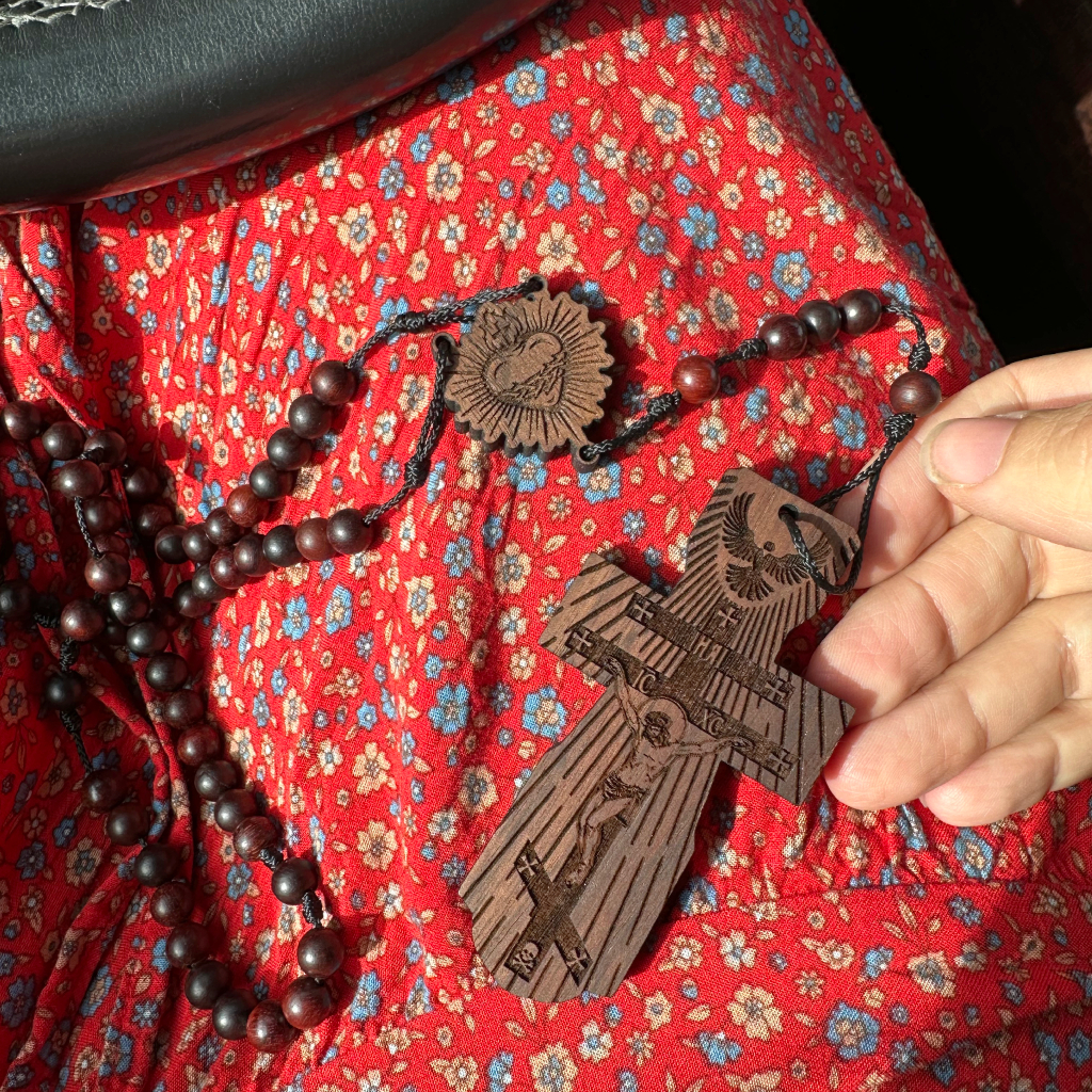 wooden rosary on women's lap